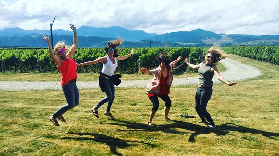 Jumping for joy to celebrate joining a full day Marlborough Wine tour